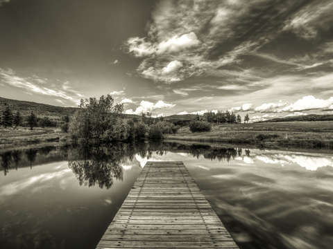 Fishing pond pier black white