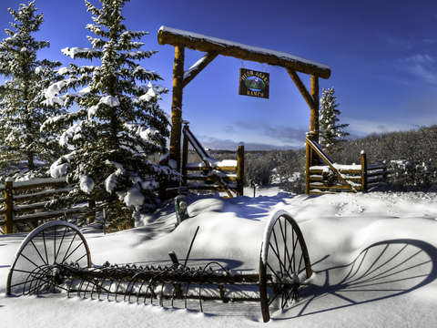 High aspen ranch entrance with snow