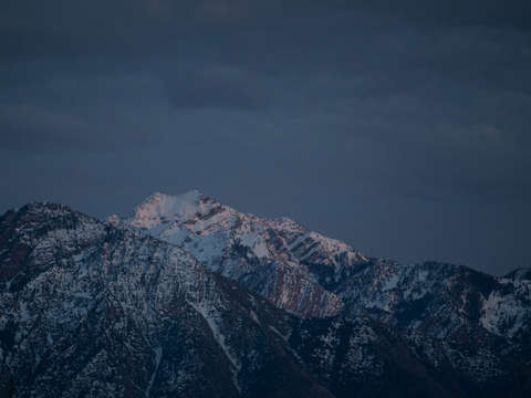 Snowy blue mountains at dusk