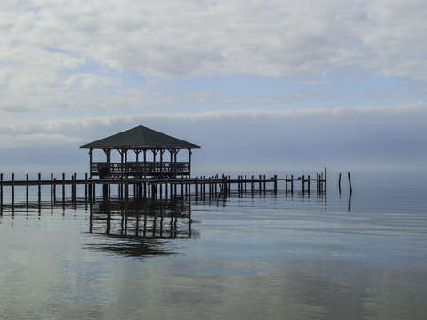 Clear blue water and the pier