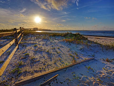 Sunrise fence and bridge to perdido