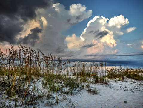 Fluffy clouds on the beach
