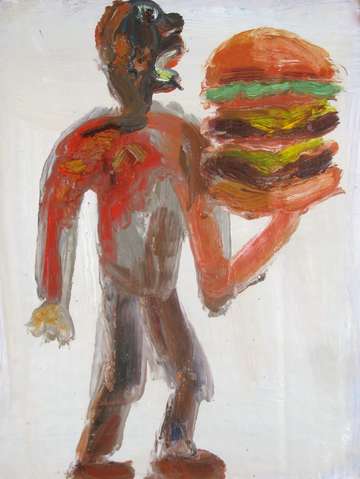 Hungry man eating a double cheese burger