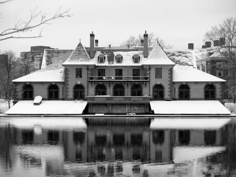 Weld boathouse at harvard reflecting in the charle