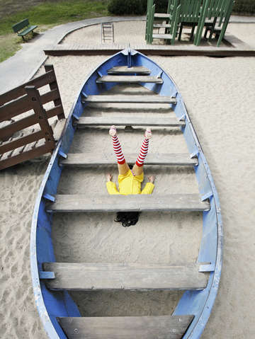 Girl under board