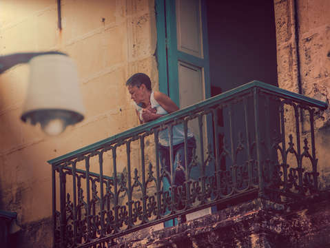 Lady on balcony in havana