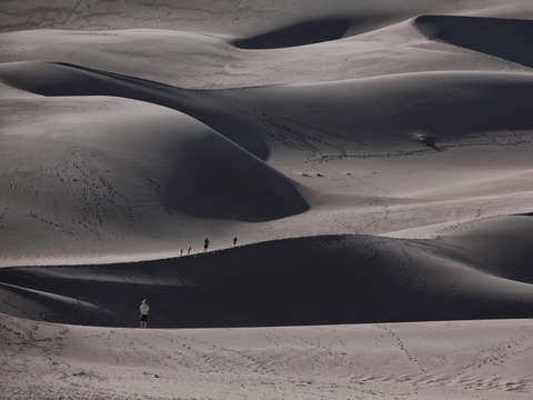 People on sand dunes