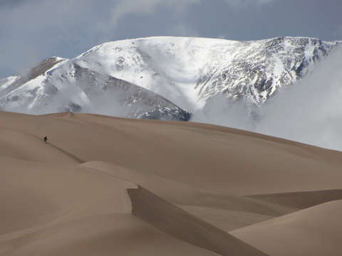 Great sand dunes and snow capped peaks