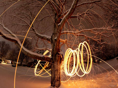 Spinning steel wool in a snowy yard