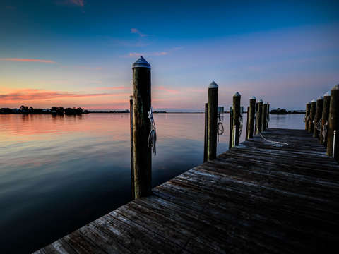 Empty dock sunrise in orange beach alabama