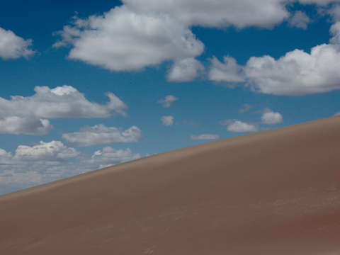 Big Clouds Over Sand Dunes