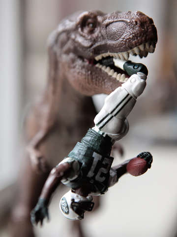 Ladainian tomlinson and a tyrannosaurus rex