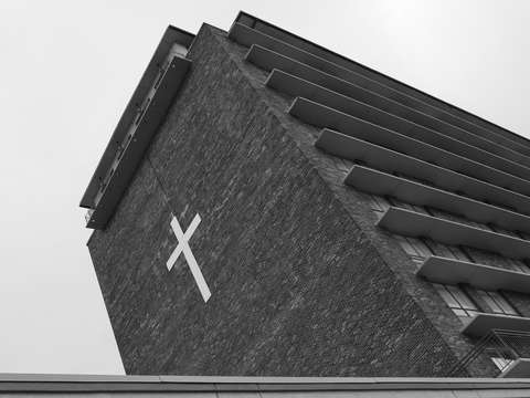 Cross on brick building