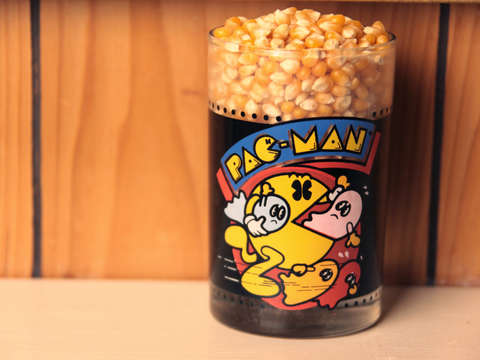 Pac man glass and popcorn kernels