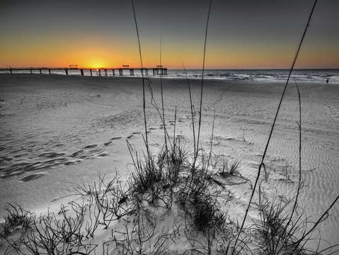 Black and white colored sky sunrise in orange beac