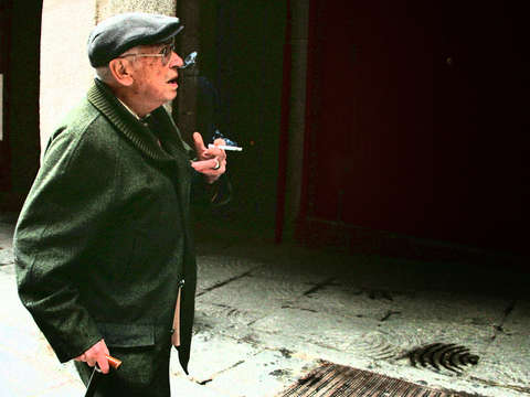 Old man smoking in madrid