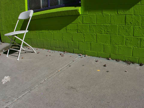 Green wall white chair