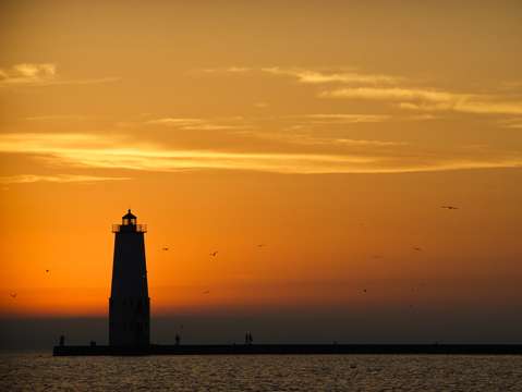 Sunset at frankfort north breakwater lighthouse