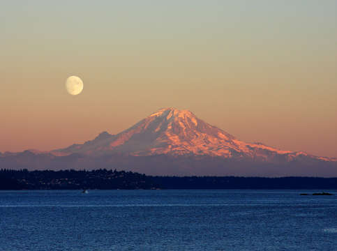 Moon rising over mount rainier