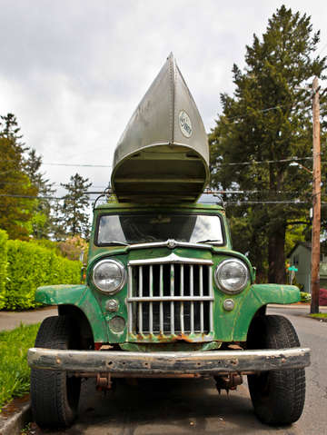 Old vehicle with canoe