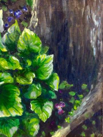 Purple pansy near the tree