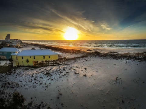 Sunrise and yellow beach house