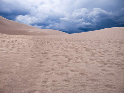 Dark clouds over sand dunes national park