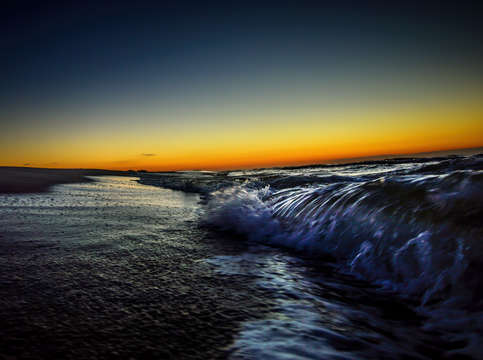 Braking waves at sunrise