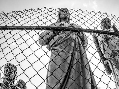 Jesus behind a fence