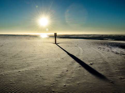 Long shadow on the beach