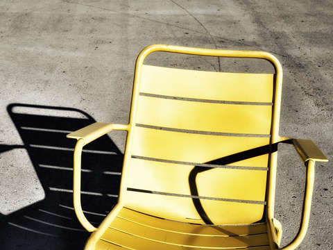 The yellow chair and its shadow