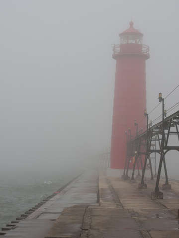 Lighthouse in thick lake michigan fog