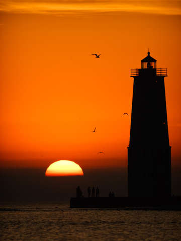 Sunset at frankfort north breakwater lighthouse 2