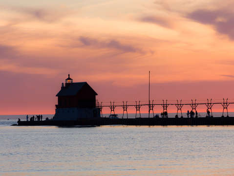 Pastel sunset over grand haven lighthouse
