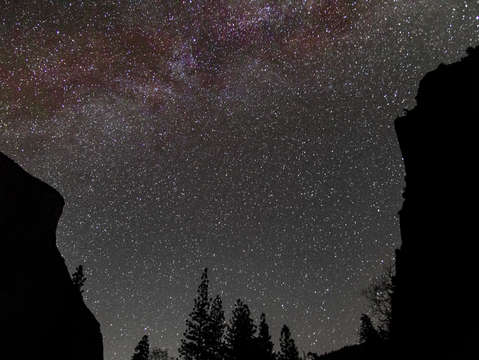Milky way galaxy between mountains
