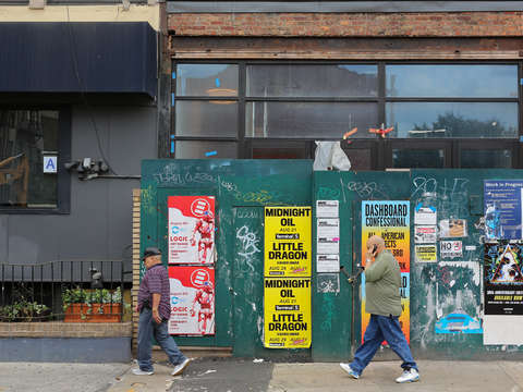 Two dudes walking in lower east side