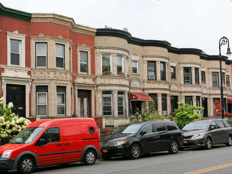 Red car brooklyn brownstones