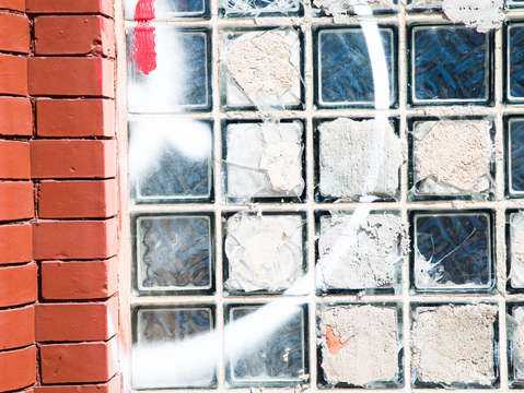 Spraypaint concrete on broken glass