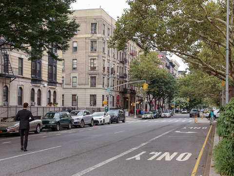 Man crossing the street in harlem nyc