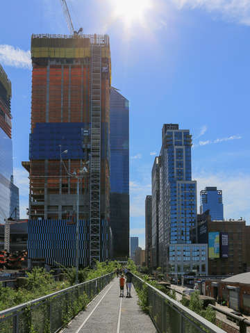 Two children walking into the sunshine along the h