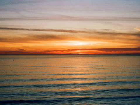 Sunset over ocean beach