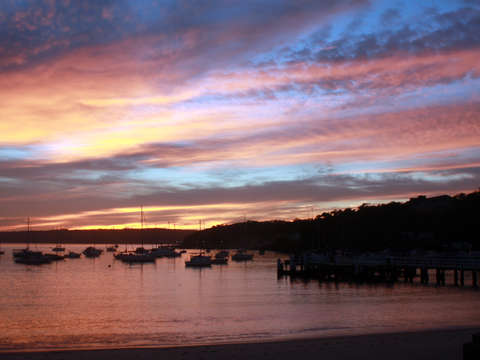 Australia balmoral beach at sunset boats in the ha