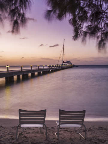 Rum point beach chairs at dusk