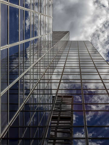 Reflective office building sky and clouds