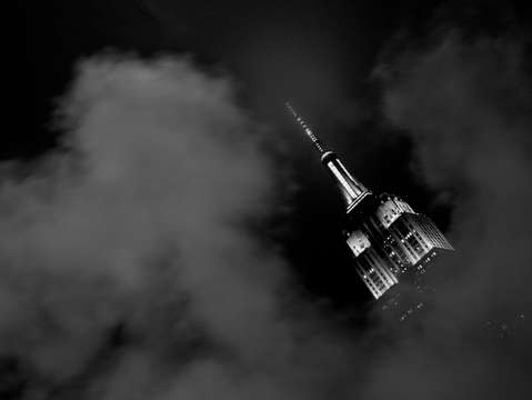 Empire state building peaking through the smoke