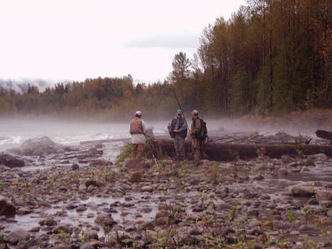 Men fishing on river