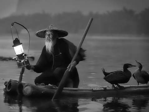 Cormorant fisherman in black white on the li river