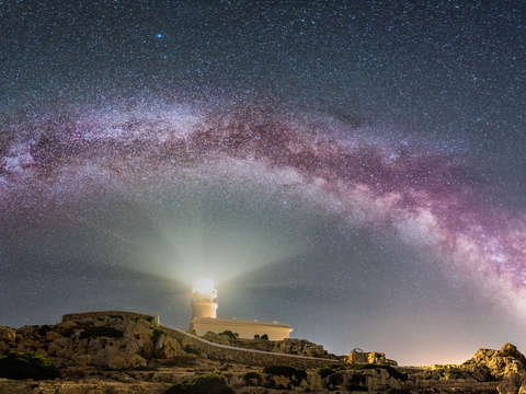 Milky way arch over cavalleria lighthouse