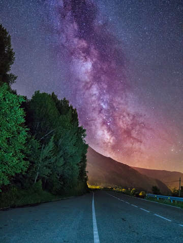Milky way over a road