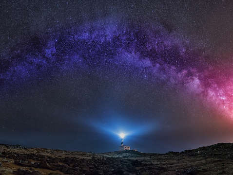 Milky way arch over fav ritx lighthouse
